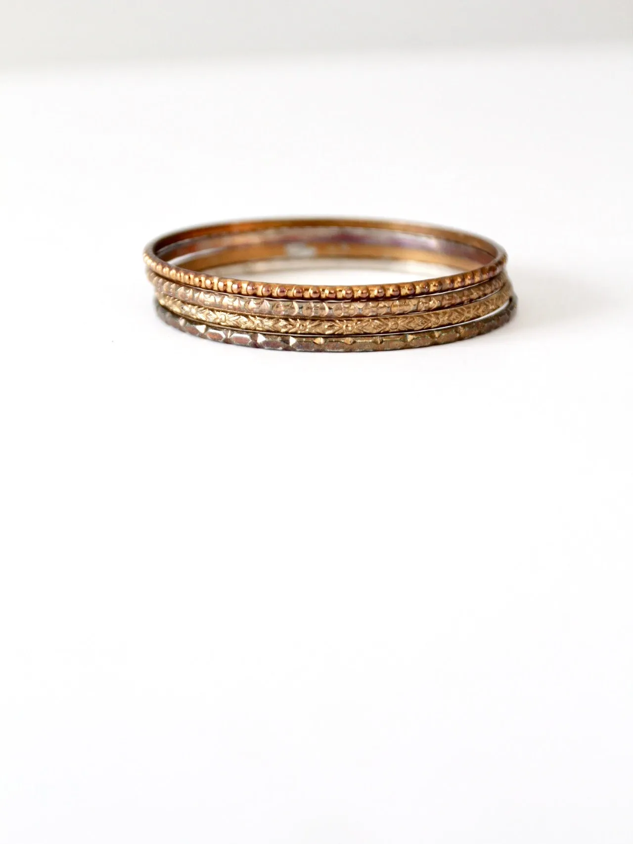 vintage thin metal stacking bangles, set of 4