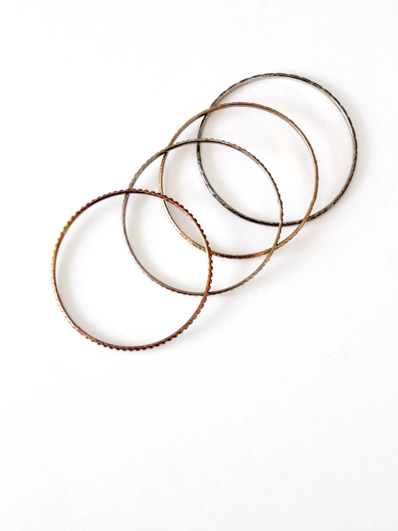 vintage thin metal stacking bangles, set of 4
